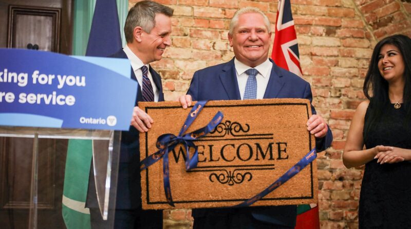 Ottawa Mayor Mark Sutcliffe presents Premier Doug Ford with a welcome mat for Ontario's new regional office in Ottawa (image source: X / @FordNation)